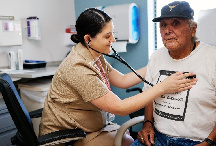 IHS Chief Clinical Consultant for Geriatrics and Palliative Care Dr. Maria Bellantoni, who is currently an internist and geriatrician at the Phoenix Indian Medical Center, checks vitals on a patient.